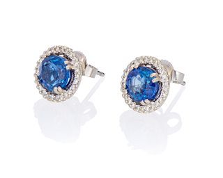 A pair of sapphire and diamond stud earrings