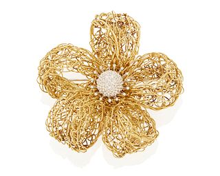 A gold and diamond flower brooch
