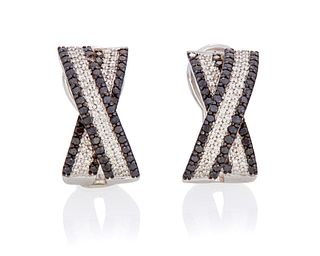 A pair of black and white diamond earrings