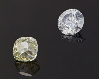 Two unmounted colored diamonds