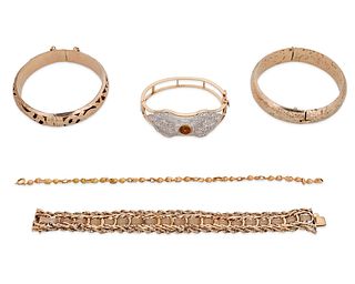 A group of gold bracelets