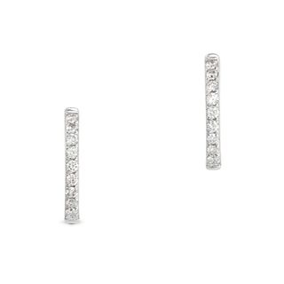 A PAIR OF DIAMOND HUGGIE HOOP EARRINGS in 18ct white gold, each designed as a hoop set with a row...