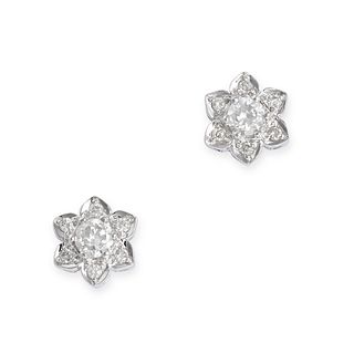 A PAIR OF DIAMOND CLUSTER EARRINGS in 18ct white gold, each designed as a flower set with round b...