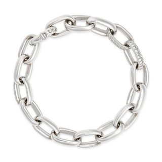 A DIAMOND BRACELETÂ comprising a row of interlocking oval links two of which are pave set with rou...