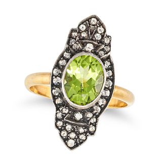 A PERIDOT AND DIAMOND DRESS RING in yellow gold and silver, the elongated face set with an oval c...