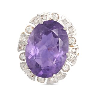 AN AMETHYST AND DIAMOND CLUSTER RING in 9ct white and yellow gold, set with an oval cut amethyst ...