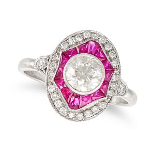 A RUBY AND DIAMOND TARGET RING in 18ct white gold, set with a round brilliant cut diamond of appr...