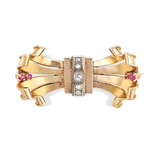 A RETRO CONTINENTAL RUBY AND DIAMOND BOW BROOCH in yellow gold, designed as a stylised bow set wi...