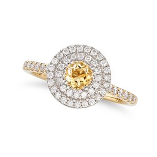 A CITRINE AND DIAMOND CLUSTER RING in 18ct white and yellow gold, set with a round cut citrine in...