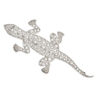 A DIAMOND LIZARD BROOCH in platinum, designed as an openwork lizard set throughout with single cu...