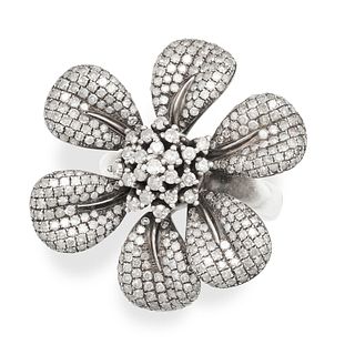 A DIAMOND DRESS RING in silver, designed as a flower, comprising a cluster of single cut diamonds...