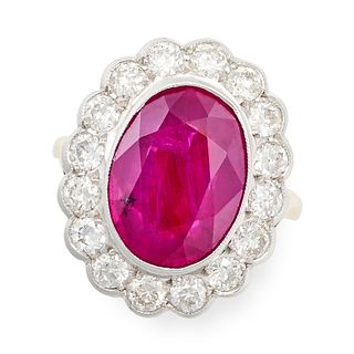 A FINE RUBY AND DIAMOND CLUSTER RING in 18ct yellow gold and white gold, set with an oval cut rub...