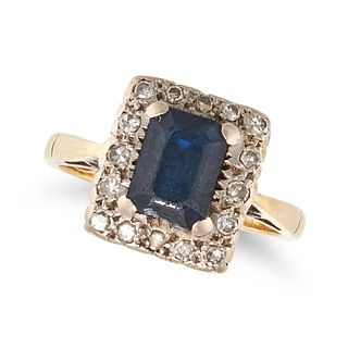A SAPPHIRE AND DIAMOND CLUSTER RING in 18ct white and yellow gold, set with a rectangular cut sap...