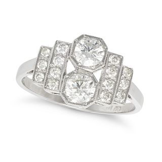 A DIAMOND DRESS RING in platinum, set with two round brilliant cut diamonds, the stepped shoulder...