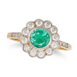AN EMERALD AND DIAMOND CLUSTER RING in yellow and white gold, set with a round cut emerald in a c...