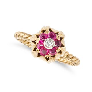 A RUBY AND DIAMOND BUD RING in 18ct yellow and white gold, set with a round brilliant cut diamond...