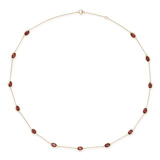 A GARNET NECKLACE in 14ct yellow gold, set throughout with oval cut garnets totalling 7.25 carats...