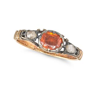 AN ANTIQUE GARNET AND DIAMOND THREE STONE RING set with a cushion cut orange garnet accented on e...