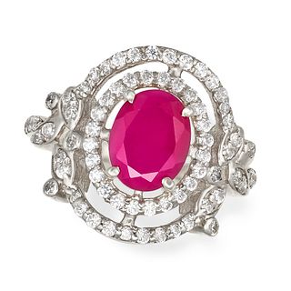 A GLASS-FILLED RUBY AND CUBIC ZIRCONIA CLUSTER RING in silver, set with an oval cut glass-filled ...