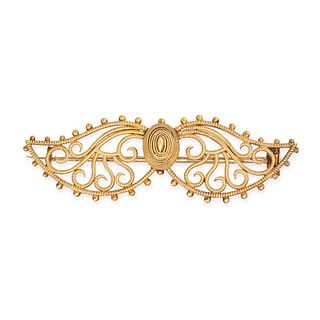 MRS. NEWMAN, AN ANTIQUE GOLD BROOCH in yellow gold, the openwork brooch designed as a pair of win...