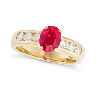 A RUBY AND DIAMOND RING in 18ct yellow gold, comprising a central oval cut ruby shouldered by row...