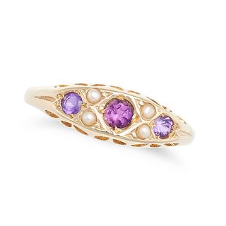 AN AMETHYST AND SEED PEARL RING in 9ct yellow gold, set with three round cut amethysts accented b...