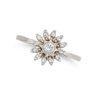 A VINTAGE DIAMOND FLOWER CLUSTER RING in 18ct white gold, set with a round brilliant cut diamond ...