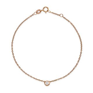 A DIAMOND CHAIN BRACELET in 18ct yellow gold, set with a round brilliant cut diamond, on a row of...
