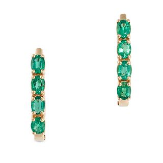 A PAIR OF EMERALD HOOP EARRINGS in 18ct yellow gold, each set with a row of four oval cut emerald...
