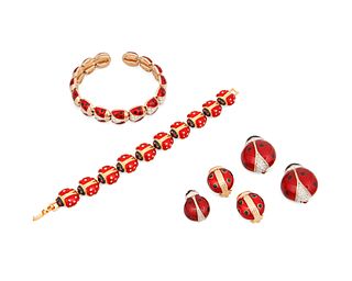 A group of vintage designer enamel ladybug costume jewelry