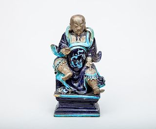Chinese Turquoise and Blue Glazed Bisque Pottery Figure of an Official