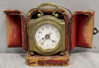 Miniature Brass Travelling Clock In Leather Case.