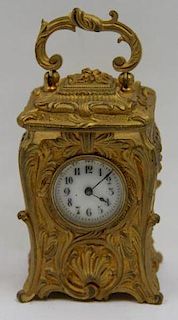 Diminutive Gilt Carriage Clock.