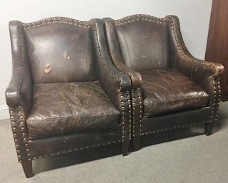 A Pair of Vintage Leather Upholstered Arm Chairs.