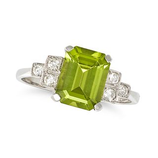 A PERIDOT AND DIAMOND RING in platinum, set with an octagonal step cut peridot of approximately 2...