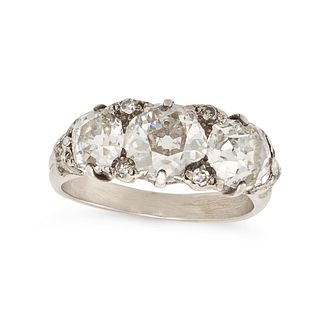 AN ANTIQUE DIAMOND THREE STONE RING in 18ct white gold, set with three old cut diamonds accented ...