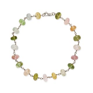A MULTICOLOUR TOURMALINE BEAD BRACELET in 14ct white gold, comprising a row of polished yellow, p...