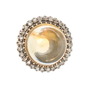 A VINTAGE CITRINE AND DIAMOND CLUSTER RING in yellow gold, set with a round cabochon cut citrine ...