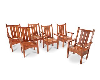 A set of Arts & Crafts-style oak armchairs