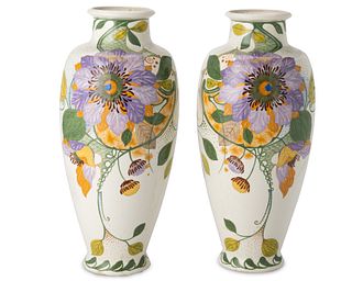 A pair of Gouda floral earthenware vases