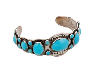 A Navajo ingot silver and turquoise cuff bracelet
