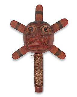A Kwakiutl-style carved wood sun rattle