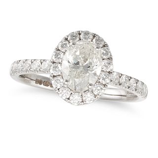 NO RESERVE - A DIAMOND HALO ENGAGEMENT RING in 18ct white gold, set with an oval cut diamond of 1...