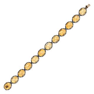 A CITRINE BRACELET in 9ct yellow gold and silver, set with a row of oval cut citrines in pinched ...