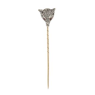 AN ANTIQUE RUBY AND DIAMOND FOX STICK / TIE PIN in 14ct yellow gold and silver, designed as the h...