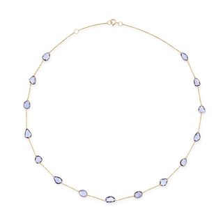 A SAPPHIRE CHAIN NECKLACE in 18ct yellow gold, the trace chain set with a row of fifteen fancy sh...