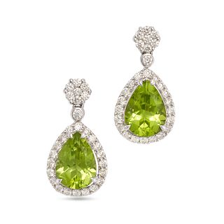 A PAIR OF PERIDOT AND DIAMOND DROP EARRINGS in 18ct white gold, each set with a cluster of round ...