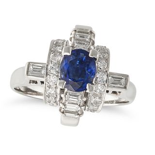 A SAPPHIRE AND DIAMOND DRESS RING in platinum, set with an oval cut sapphire of 0.91 carats on a ...