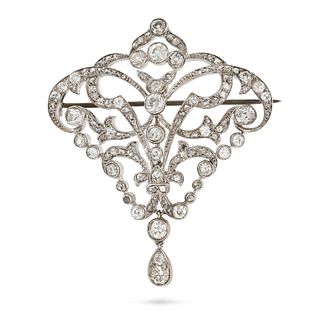 AN ANTIQUE EDWARDIAN DIAMOND BROOCH in rhodium plated gold, the openwork scrolling brooch set thr...