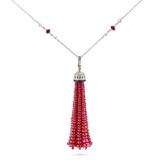 A RUBY, DIAMOND, ONYX AND WHITE TOPAZ TASSEL PENDANT NECKLACE in 18ct white gold, the tassel form...